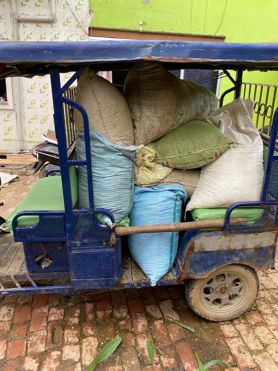 A rickshaw loaded with grass